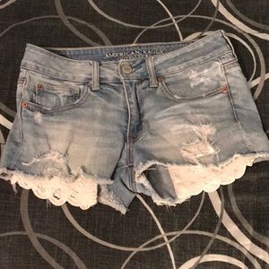 American Eagle denim shorts with lace pockets